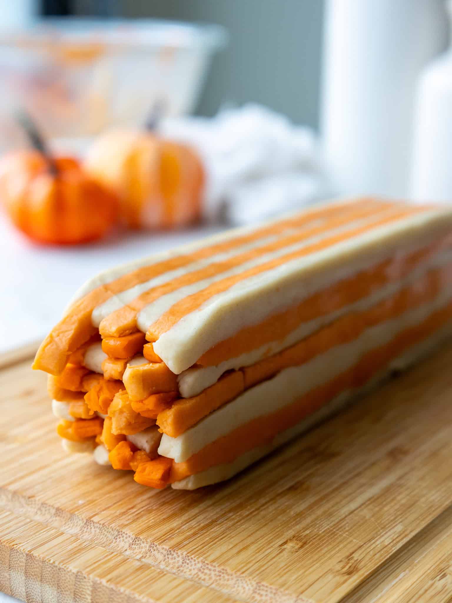 image of a shortbread cookie dough log that's been stacked to create a gingham pattern