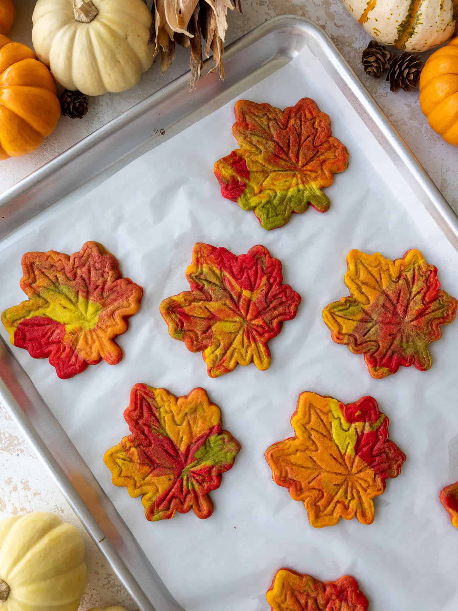 image of marbled cookies that've been made with marbled cookie dough to look like fall leaves