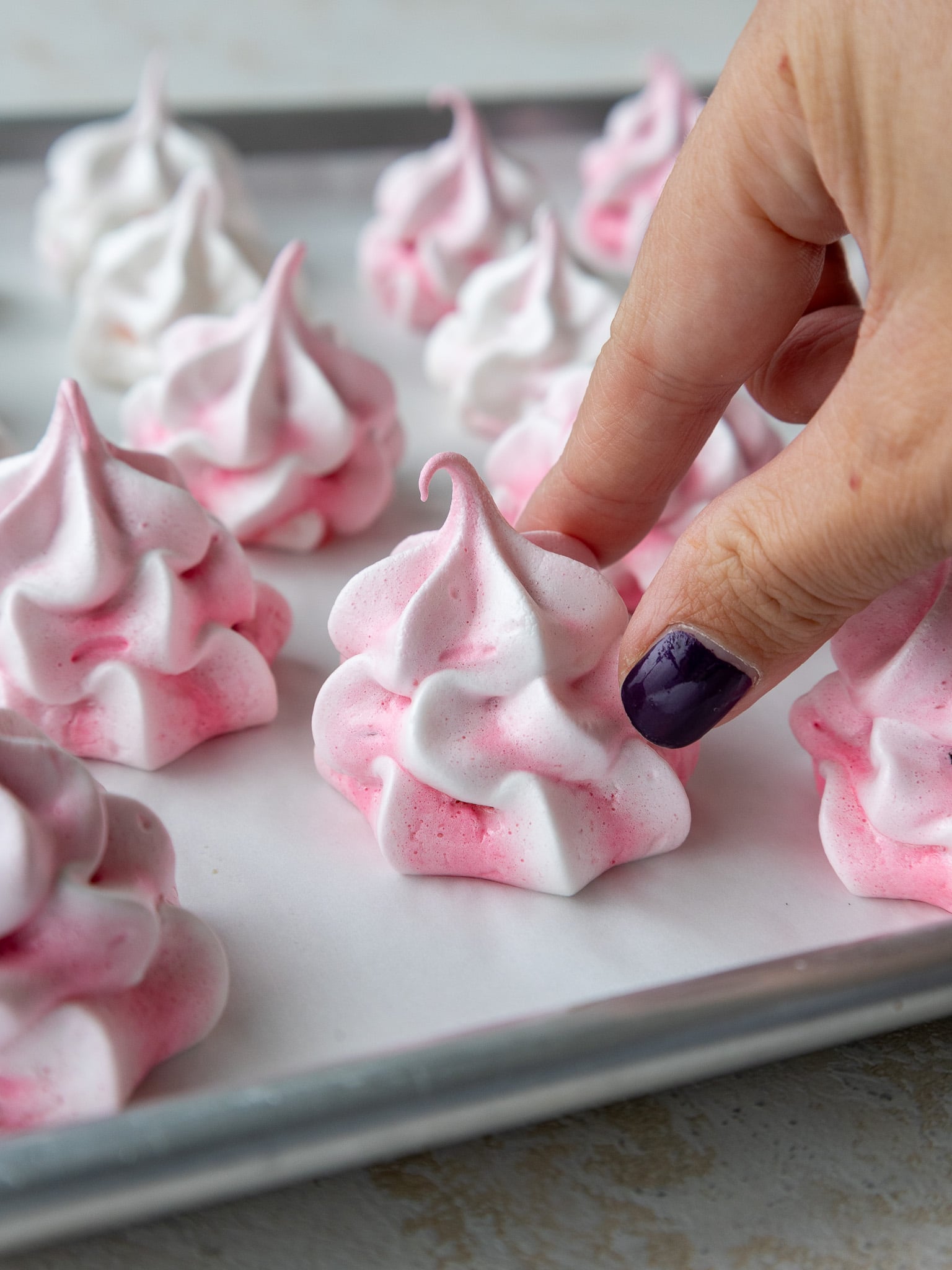 image of piped meringue cookies before baking
