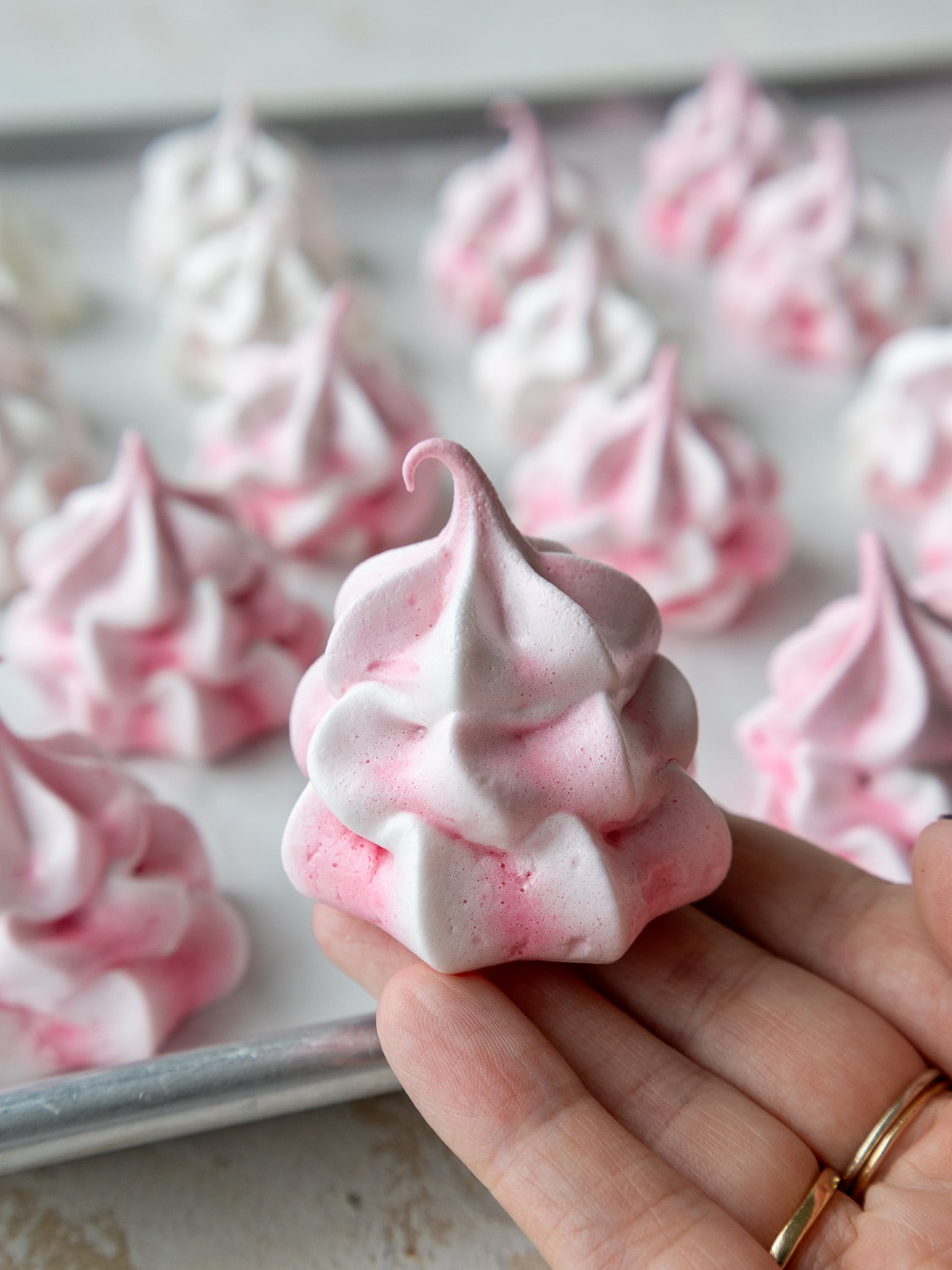 image of finished pink meringue cookies piled together