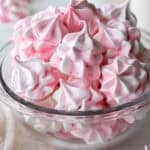 image of meringue cookies that have been colored pink and piped with a large french piping tip