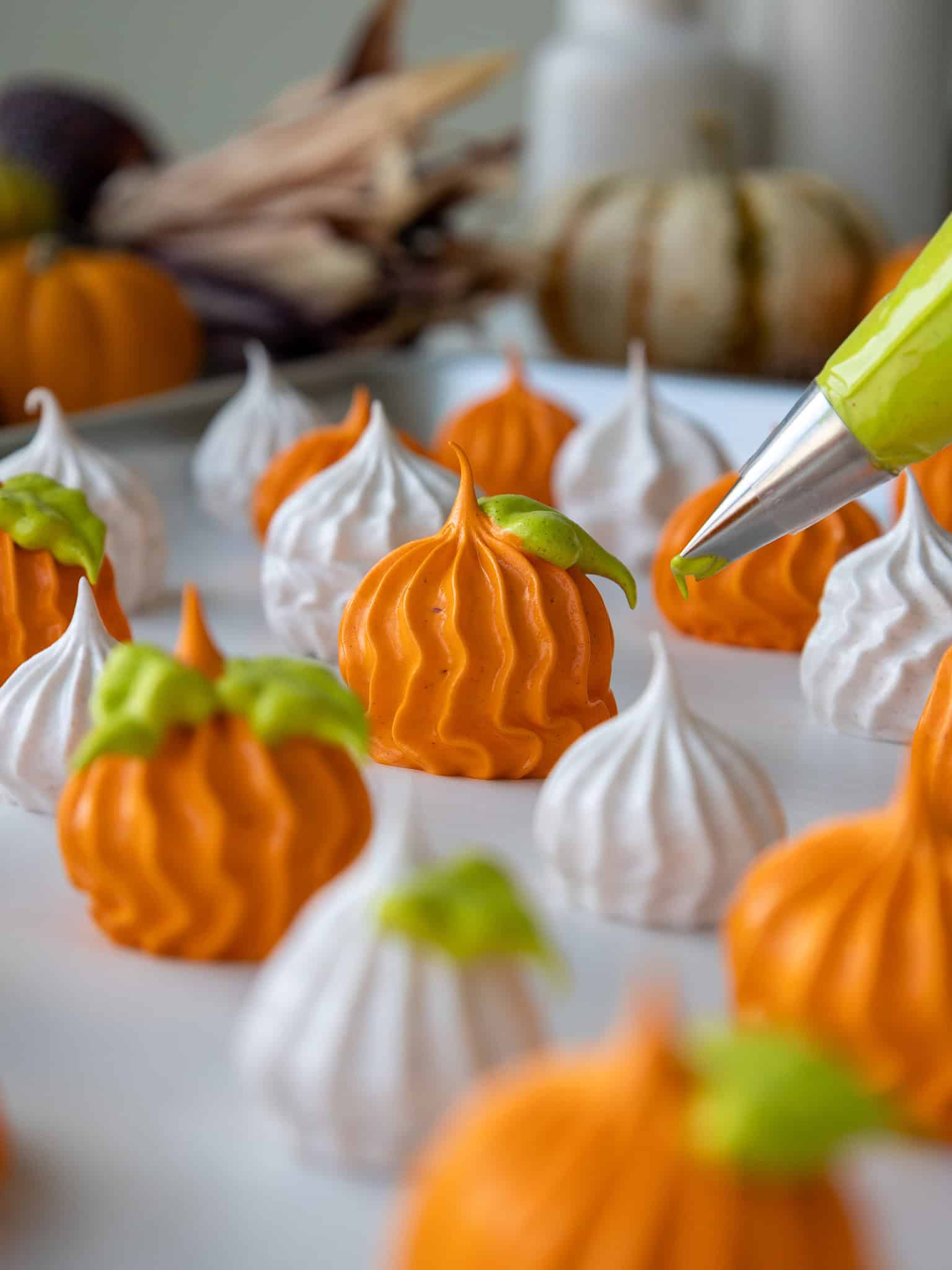 image of pumpkin spice meringues being piped